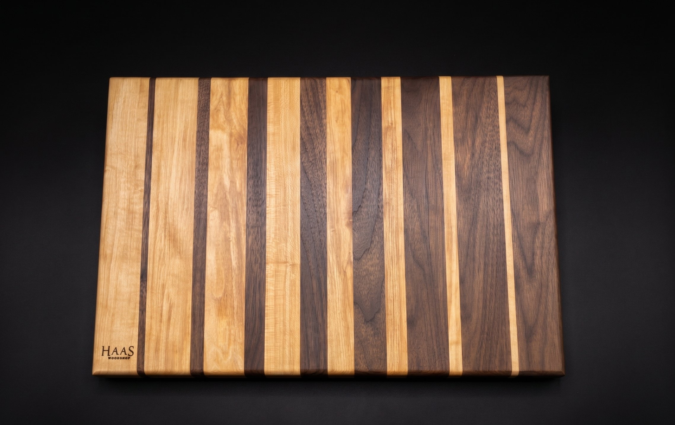 Horizontal striped cutting board with padauk accent